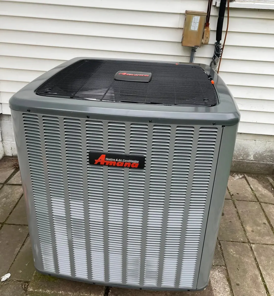 New Amana air conditioning condenser installed at a Tulsa home