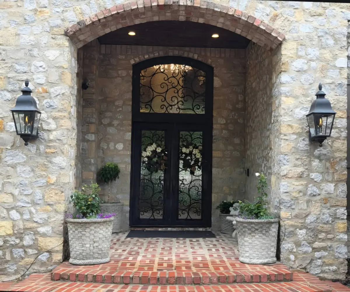 Natural gas entry lanterns mounted beside a front door
